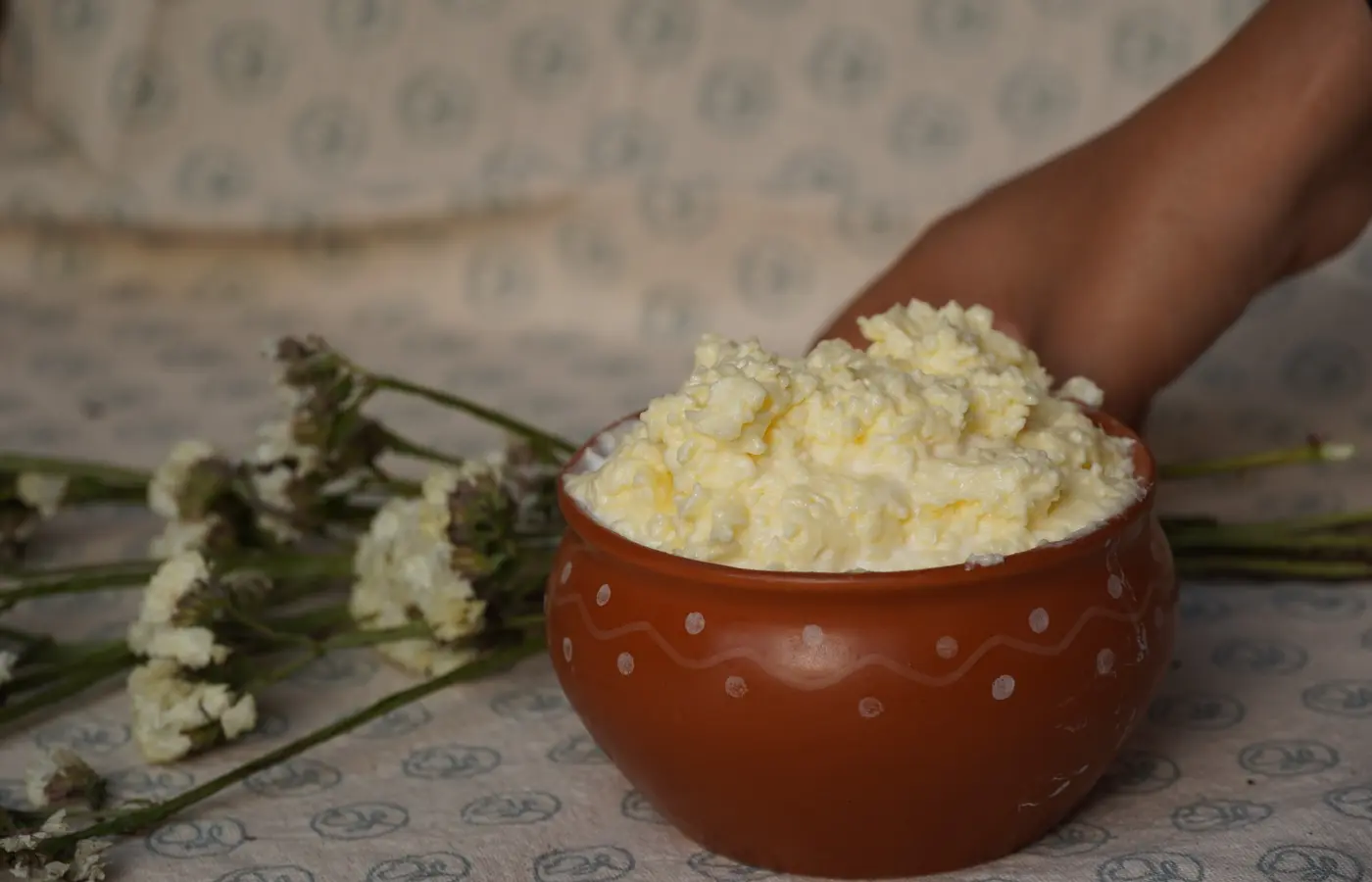 Fresh white butter served in an earthen bowl